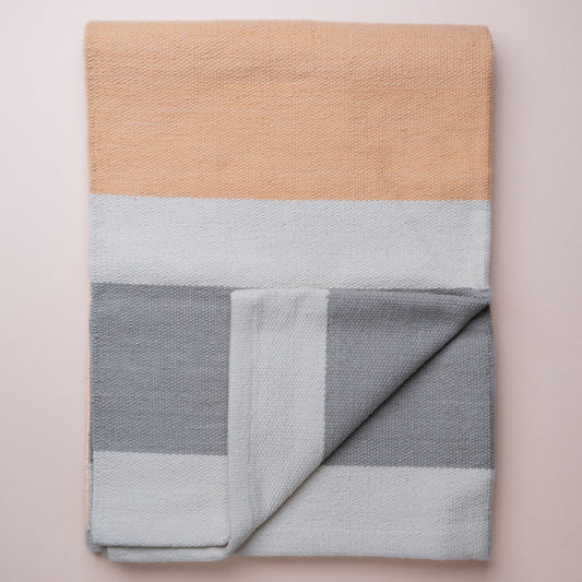 Orange cotton yoga rug made from organic cotton & herbaly dyed. 