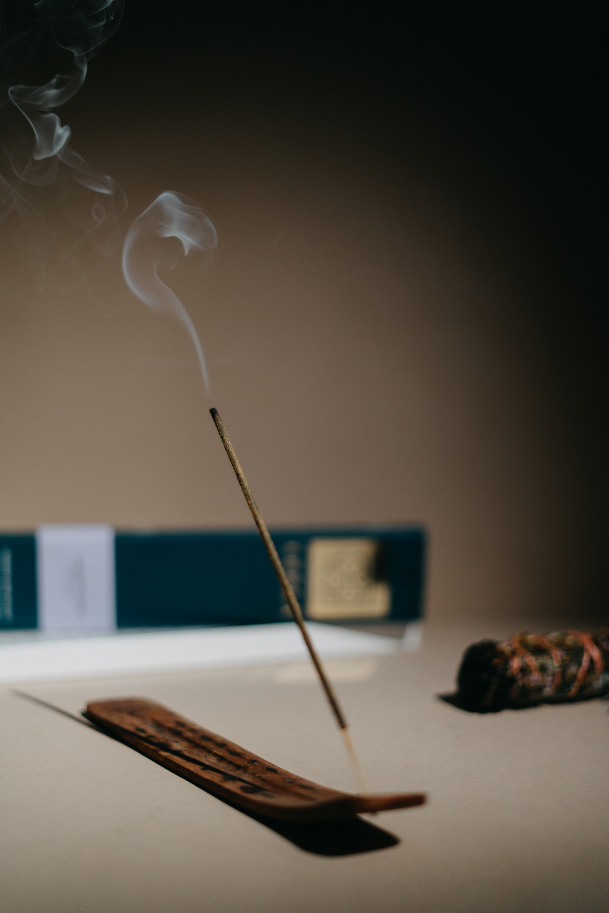 Sacred flowers hand-rolled incense stick is burning in the room. Incense from Leela divine play. 